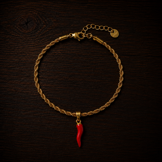 Bracciale intrecciato con corno rosso